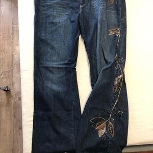 Embroidered denim jeans with boot cut legs